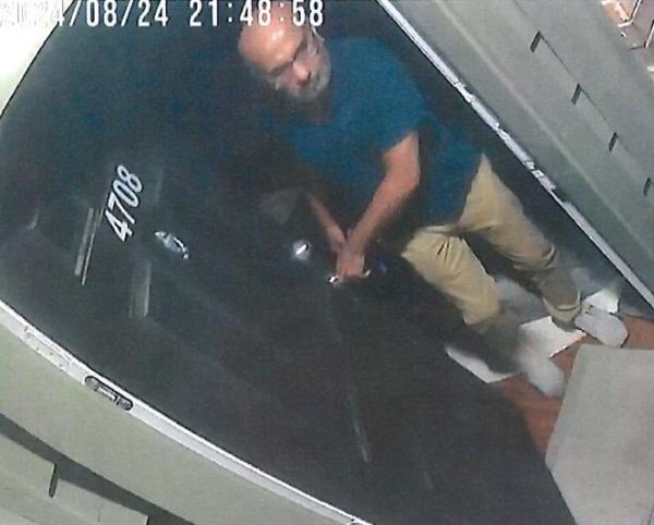 Surveillance footage of the suspect seen leaving Pandey's apartment.